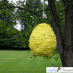 DIY Beehive pinata with newspaper mache and crepe paper. Easy diy teddy bear picnic party decoration #partydecor #picnic #birthday #party