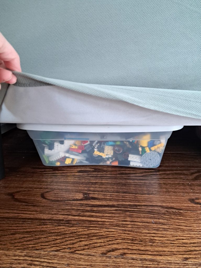 living room toy storage under the sofa