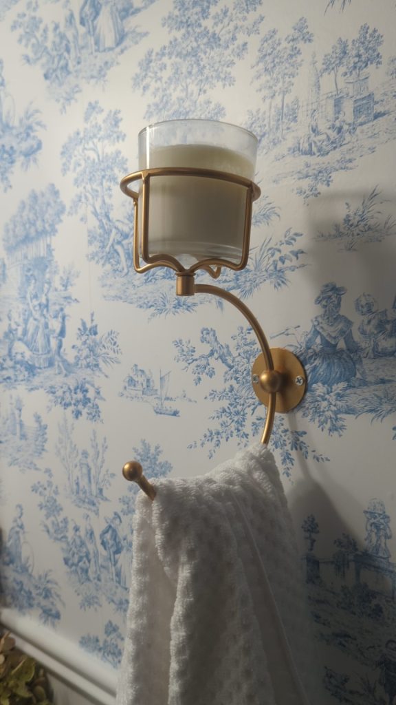 Gold towel hook candle holder