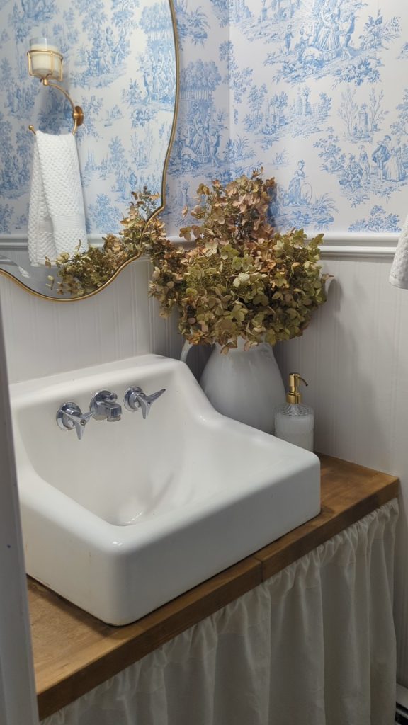 Powder Room makeover with blue toilet and beadboard wallpaper from Lowe's! 