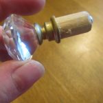 Make curtain rod finials out of kitchen knobs