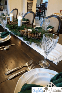 Create a neutral winter tablescape and natural Christmas decor using fresh greenery and affordable supplies. Make an easy DIY table centerpiece that works through the holidays and into winter. #winterdecor #neutraldecor #farmhousechristmas #tablescape #christmas