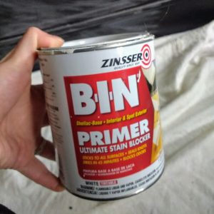 bin primer. Use a quality primer for painting over laminate furniture