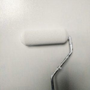 Use a roller paint over laminate to minimize brush strokes