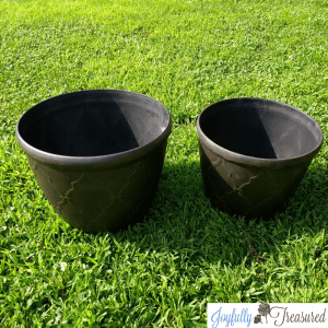 Create a DIY solar fountain planter for the garden using flower pots
