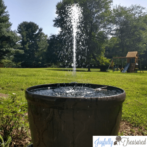 Create a water feature for your garden in just minutes with this DIY solar fountain planter tutorial #gardenideas #honest #budgetdecor #gardendiy #solar