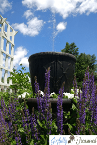 Create a DIY solar water fountain planter for the yard or garden. Create a custom water feature on a budget! #gardenideas #diy #gardening #solar #homediy #gardendecor #gardenprojects #gardendiy #outdoordecor