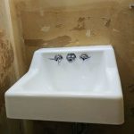 painting the bathroom sink, easy DIY bathroom makeover using Rustoleum tub and tile refinishing kit. makeover this dated 1960's powder room to farmhouse style for just $100! #budgetdecor #homediy #bathroomdiy #budgetreno #beforeandafter
