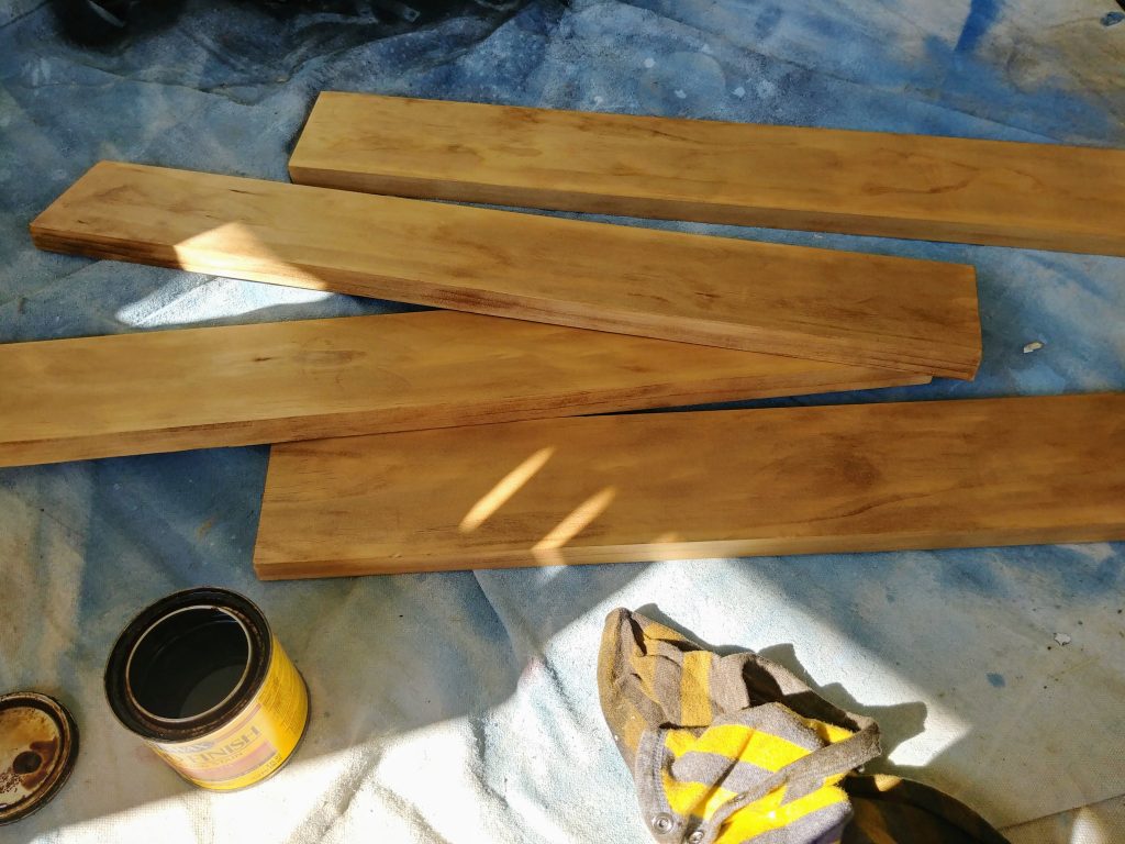 Industrial farmhouse bathroom mirror with corner L brackets for a $100 bathroom makeover. We took our 1960s powder room and updated it to farmhouse style with just a $100 budget. Lots of great ideas for DIY budget bathroom decor. #budgetdecor #homediy #bathroomdecor #farmhousedecor #farmhousestyle #bathroomideas #rustic