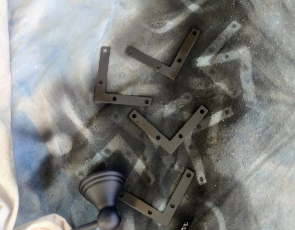 Spray paint the brackets before assembling the mirror