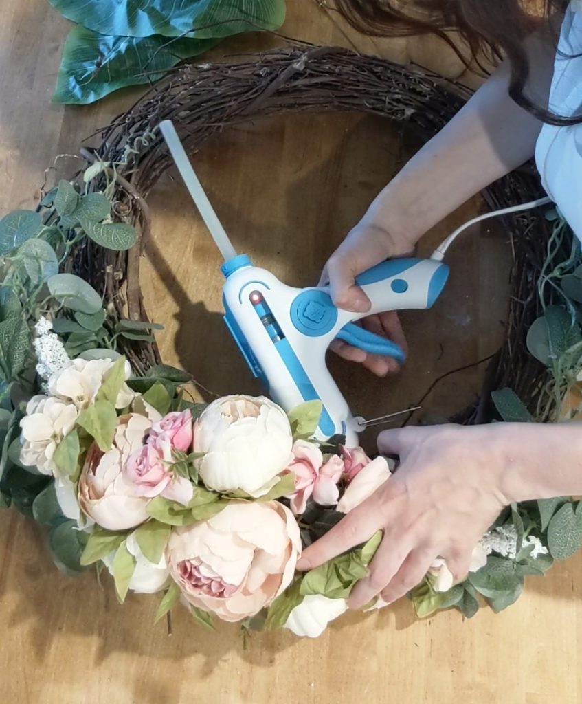 making a spring floral wreath in minutes with a ready to go floral swag. quick and easy DIY
