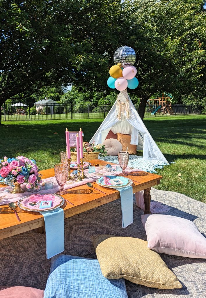 blue and pink decor with gold and disco accents for luxury backyard picnic table for Taylor Swift themed birthday