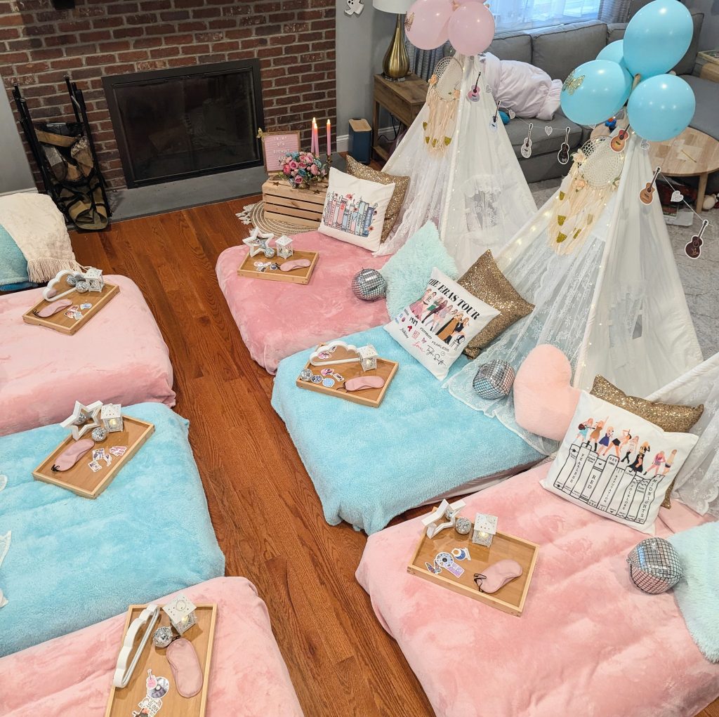 Swiftie sleepover party with pink and blue decor and disco ball and gold accents