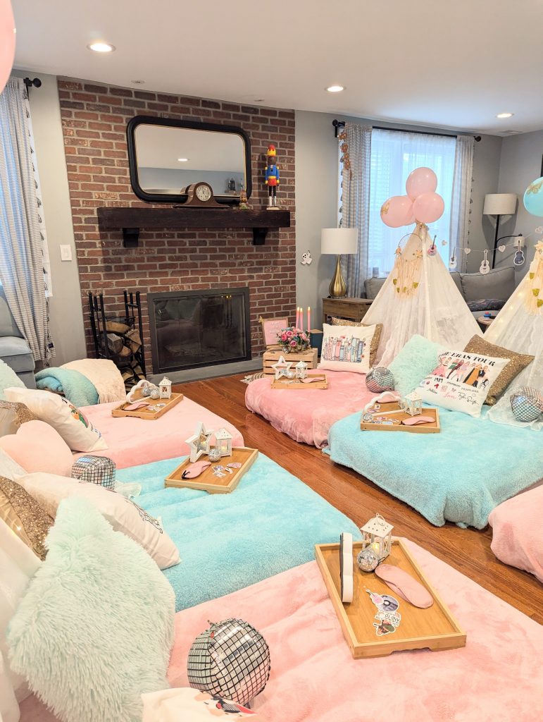 Taylor Swift themed sleepover setup with cozy floor beds and fairy lights, Lace teepee and pink and blue balloons